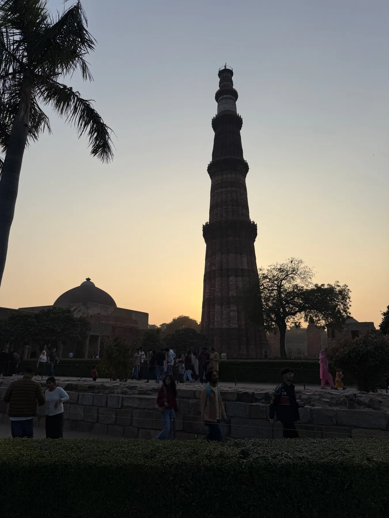 The Qutub Minar silhouetted at sunset on a one-day Delhi blitz before flying home
