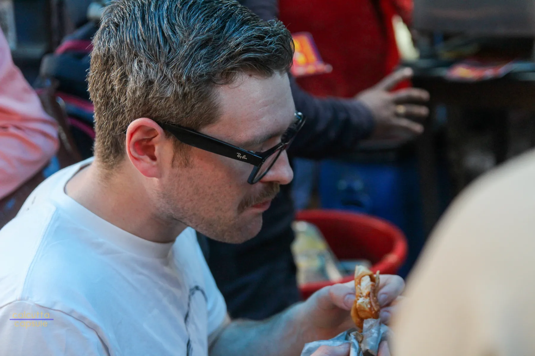 Mid-bite on Kolkata street food during a morning food walk