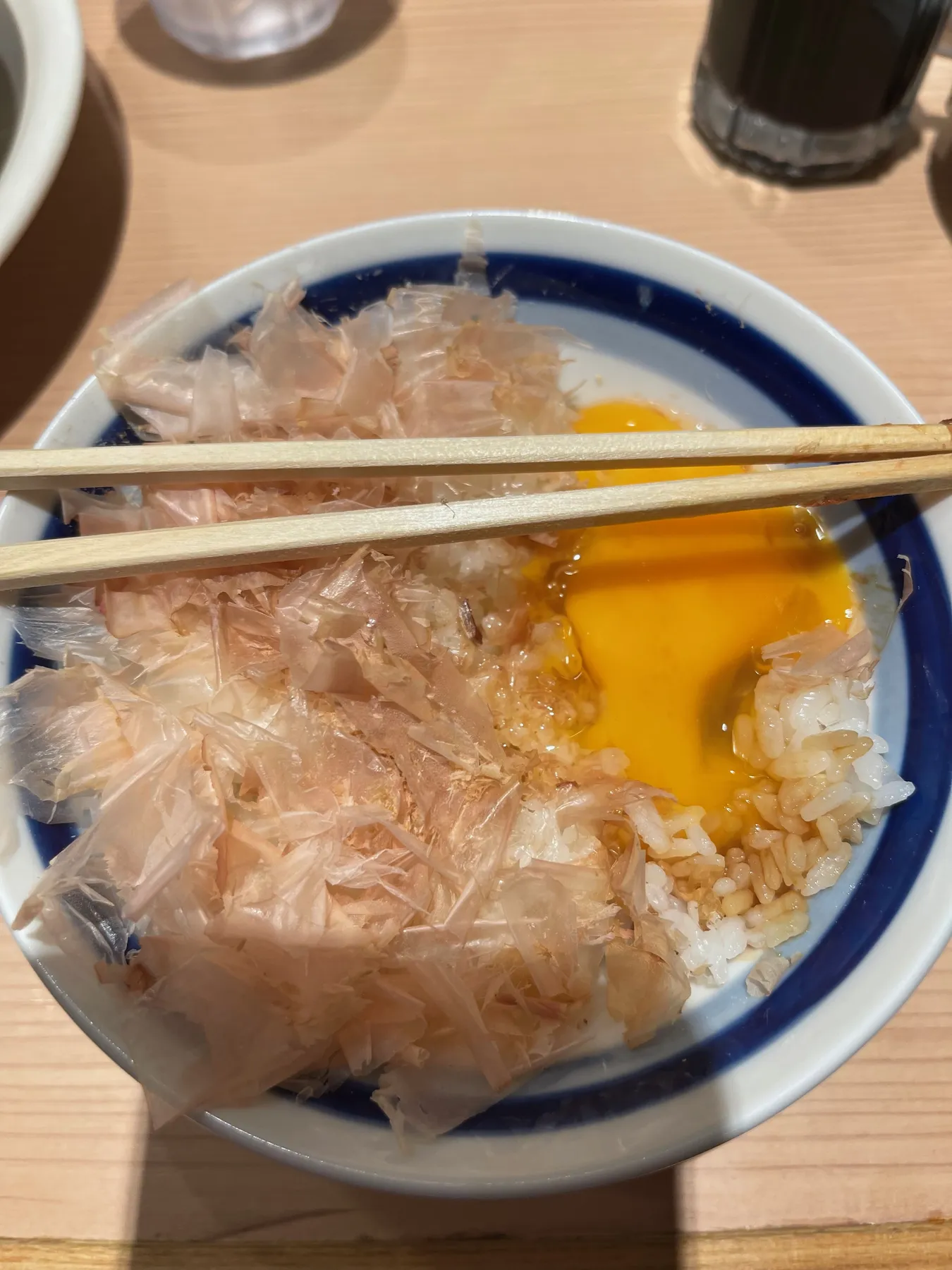 Tamago kake gohan with bonito flakes: my first raw egg, cracked over rice